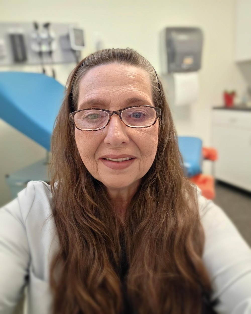 Mary Bratcher, founder of PulsePoint Mobile, smiling in an exam room
